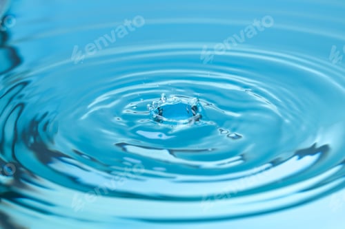 Preview: Splash of blue water with drop, closeup