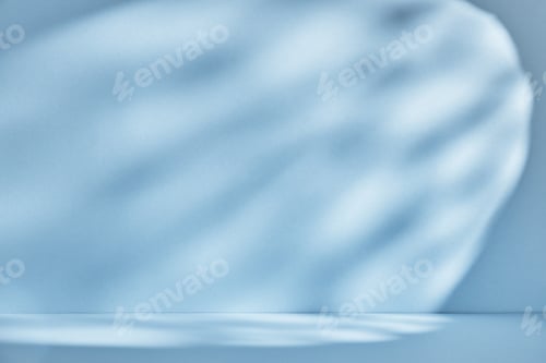 Preview: Backdrop for product presentation. Blue background with drop shadows and light.