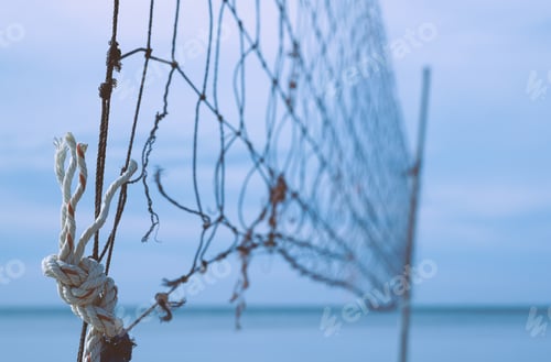 Preview: Beach volleyball net left on the beach