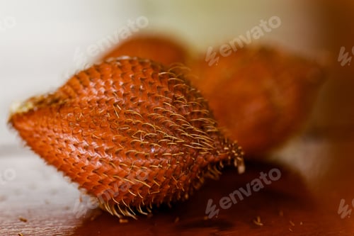 Preview: Closeup of salak or snake fruit on wooden table