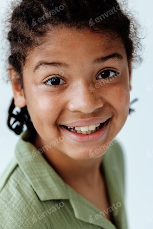 Preview: Happy african american boy in trendy green shirt smiling for the camera