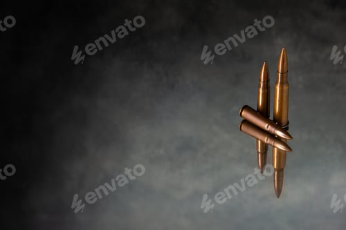 Preview: front view of brown bullets on a gray background gun tank death war shooting