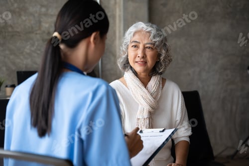 Preview: Asian young nurse supporting elderly patient disabled woman in hospital. Elderly patient care concep