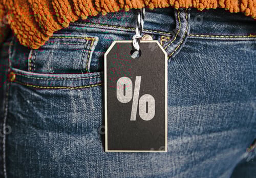 Preview: Close-up of discount sign on tag on a pair of jeans
