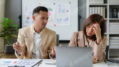 Preview: Stressed asian businesspeople having problems and arguing about project strategy during meeting