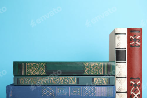 Preview: Collection of old books on light blue background