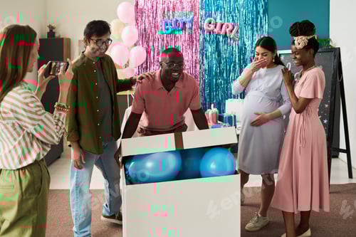 Preview: Black man opening box with blue balloons while pregnant woman and friends reacting with excitement