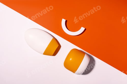 Preview: two plastic unlabeled bottles on double white and orange background. SPF sunblock skin care