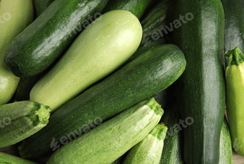Preview: Top view of fresh ripe zucchini as background, closeup