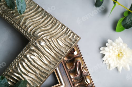 Preview: Corners of decorative wooden empty picture frames.