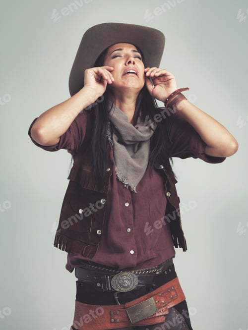 Preview: The saloons outta whisky Noooooo. Cropped shot of an attractive young woman in cowboy attire.