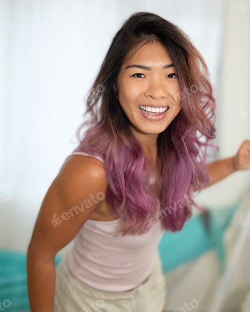 Preview: Candid shot of Smiling Asian woman with curly hair