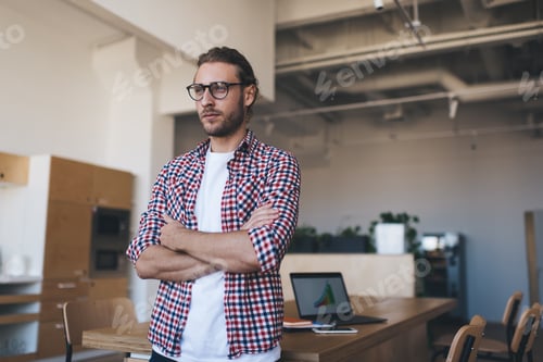 Preview: Pensive Caucaisan man in optical eyewear pondering on marketing plan