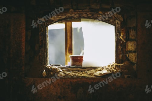 Preview: Ancient destroyed opening inside a wall with a blurred background