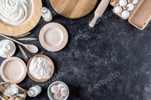 Preview: flay lay with arranged bread bakery ingredients and kitchenware on marble tabletop