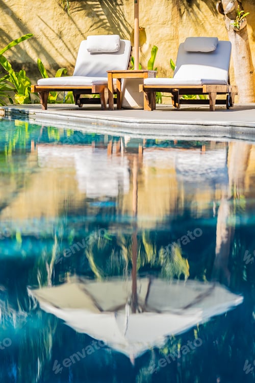 Preview: Umbrella and chair around outdoor swimming pool