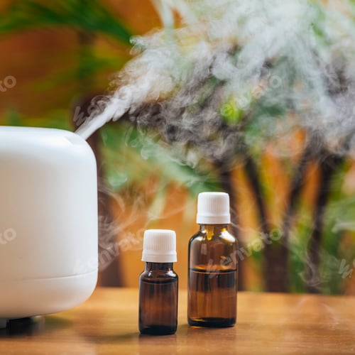 Preview: Natural Essential Oil Bottles and Aroma Therapy Diffuser on a Wooden Table