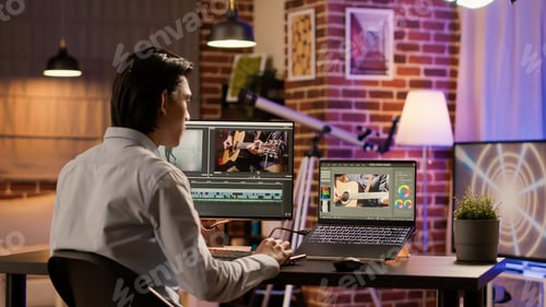 Preview: Media freelancer using film production software on computer
