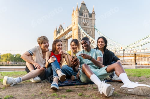 Preview: Multiracial group of happy young friends bonding in London