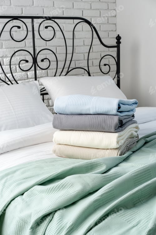 Preview: Black Metal Bed Frame With White Brick Wall And Green Blanket