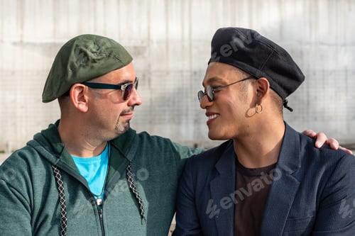 Preview: Gay male couple hugging and looking at each other
