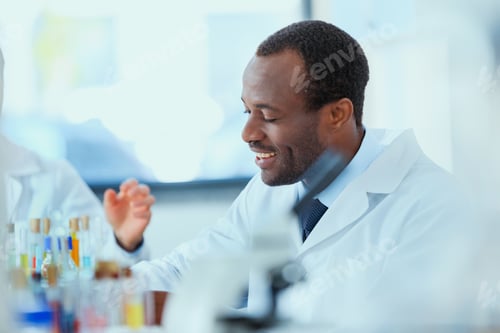Preview: young doctors in uniform working at testing laboratory, chemical laboratory