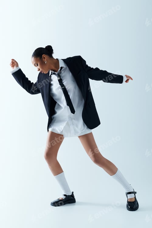 Preview: Timeless grace: young african american woman in white dress and black blazer