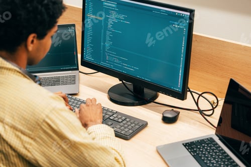 Preview: young programmers working on a new project for a start up business.