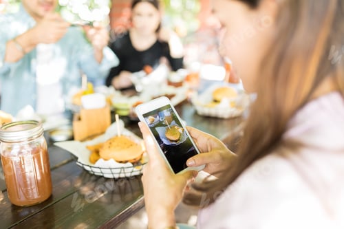 Preview: Woman Sharing Cheeseburger Pictures On Networking Site