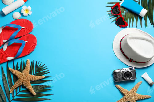 Preview: Flat lay composition with stylish beach accessories on light blue background, space for text