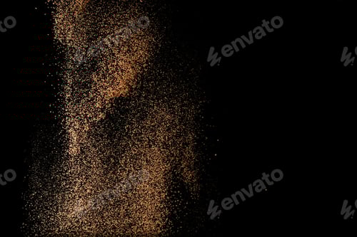 Preview: Cocoa powder sifting isolated on black background. Chocolate dust on black background. Copy space