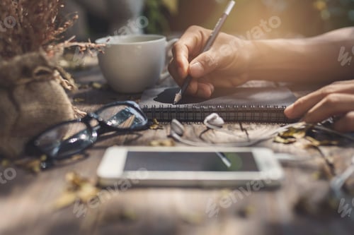 Preview: Notebook with cup of coffee and cellphone