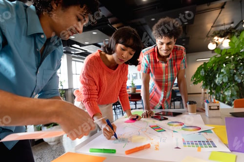 Preview: Creative multiracial colleagues planning strategy in meeting at office
