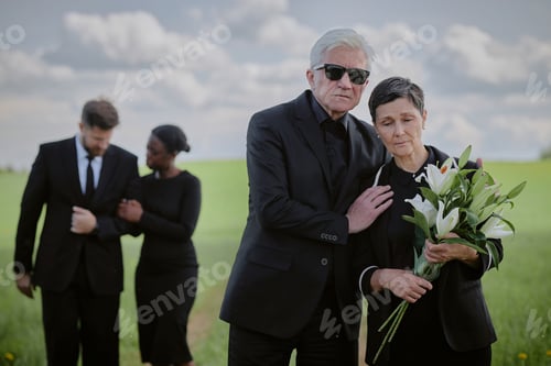 Preview: Senior Caucasian Man Comforting Middle Aged Caucasian Woman Mourning Outdoors