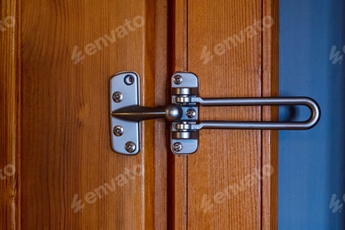 Preview: Close up wooden door with metallic lock