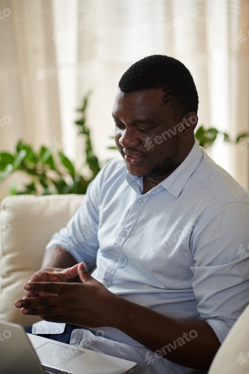 Preview: Businessman Explaining Idea at Online Meeting