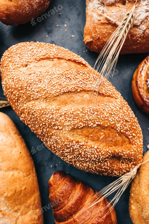 Preview: Different types of fresh bread and bakery on the table.