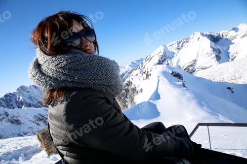 Preview: A young woman looking at the sky station in the city of Innsbruck