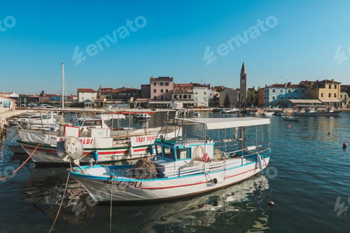 Preview: Explore the vibrant harbor of Pula Croatia with charming boats and picturesque architecture