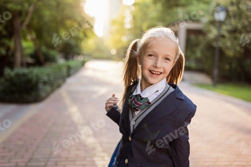 Preview: Little Caucasian Girl With Blonde Hair Going to School With Backpack