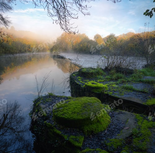 Preview: Old moss covered millstones on the bank of the Mino river