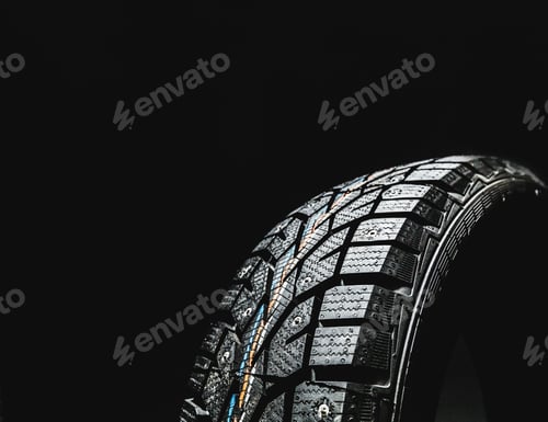Preview: Detailed close-up of a winter tire showcasing tread design and grip features