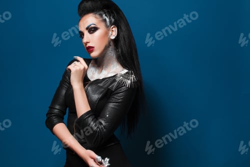 Preview: Girl With Creative Make-Up On A Blue Background
