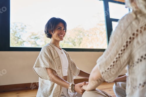 Preview: Woman Helping Another With a Yoga Pose