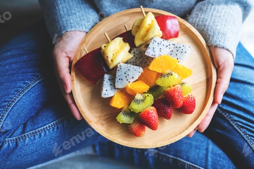 Preview: Wooden Plate of Fresh Colorful Fruit Skewers