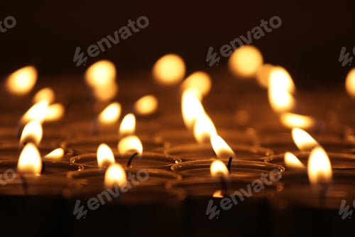 Preview: Burning Tea Candles In Dark Room