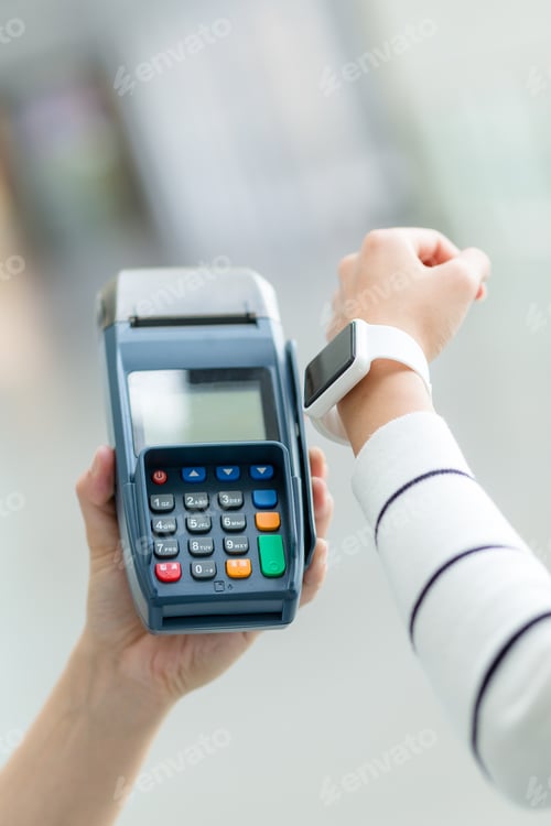 Preview: Woman using smartwatch for pay the bill