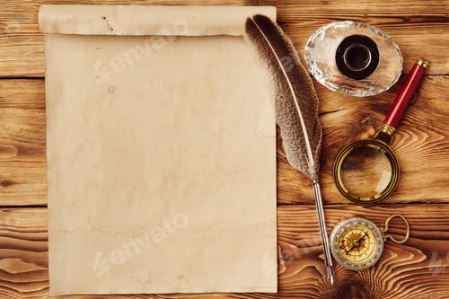 Preview: Old paper on brown wood background with feather