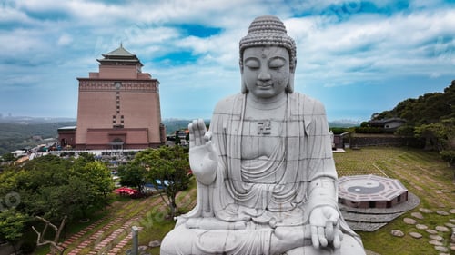 Preview: Serene giant Buddha statue overlooking the landscape at a cemetery in Taiwan