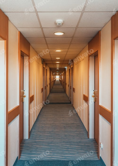 Preview: Empty hotel hallway with wooden doors